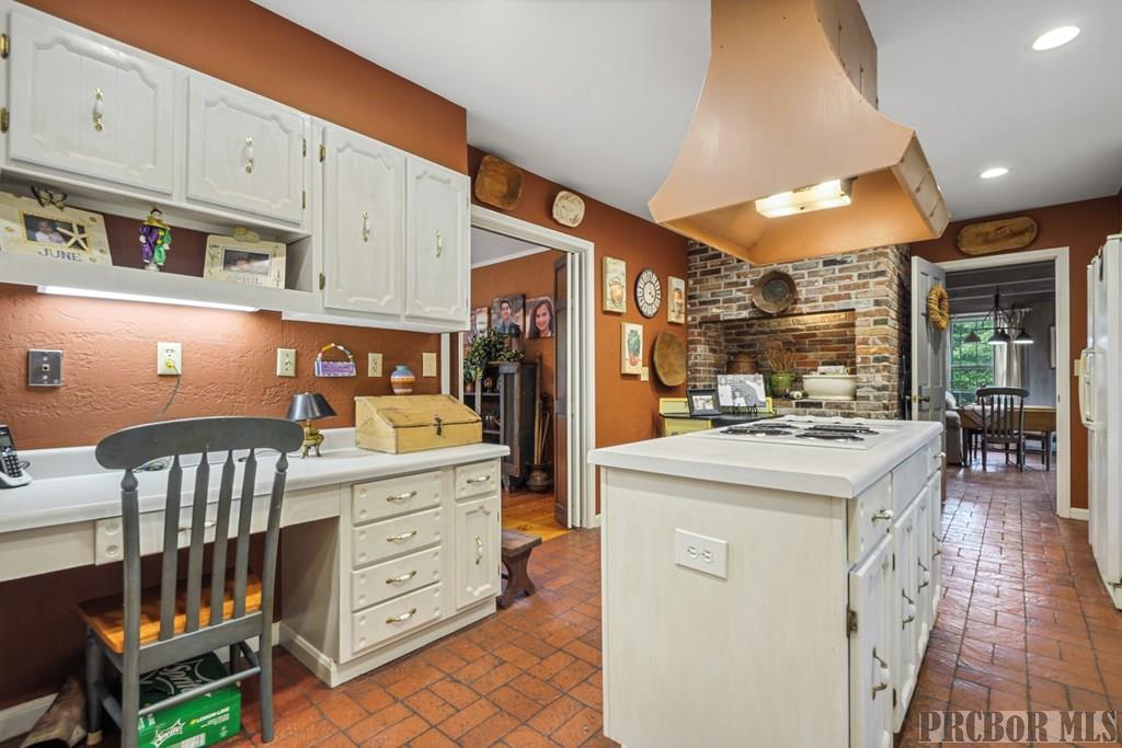 Kitchen flows into dining and den